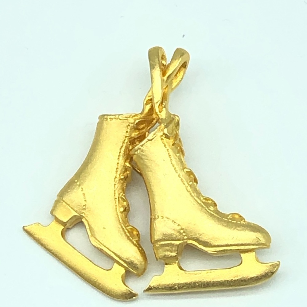 Vintage goldtone ice skates  brooch.